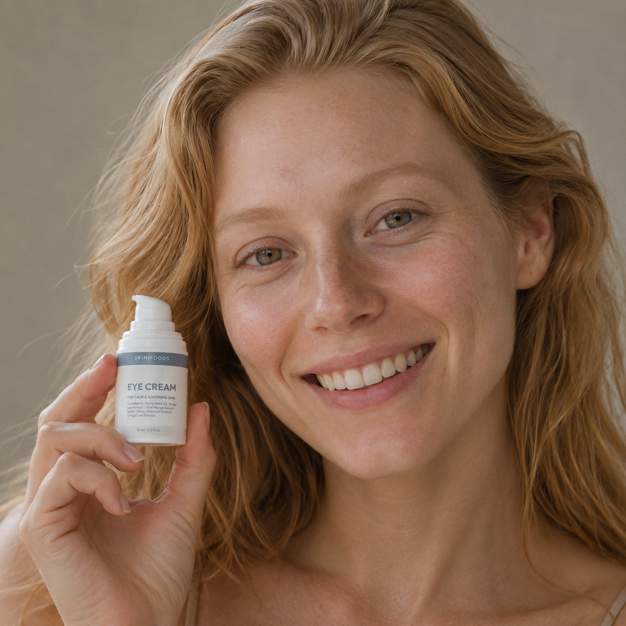 Model with Skinmoods Calming Eye Cream in her hand