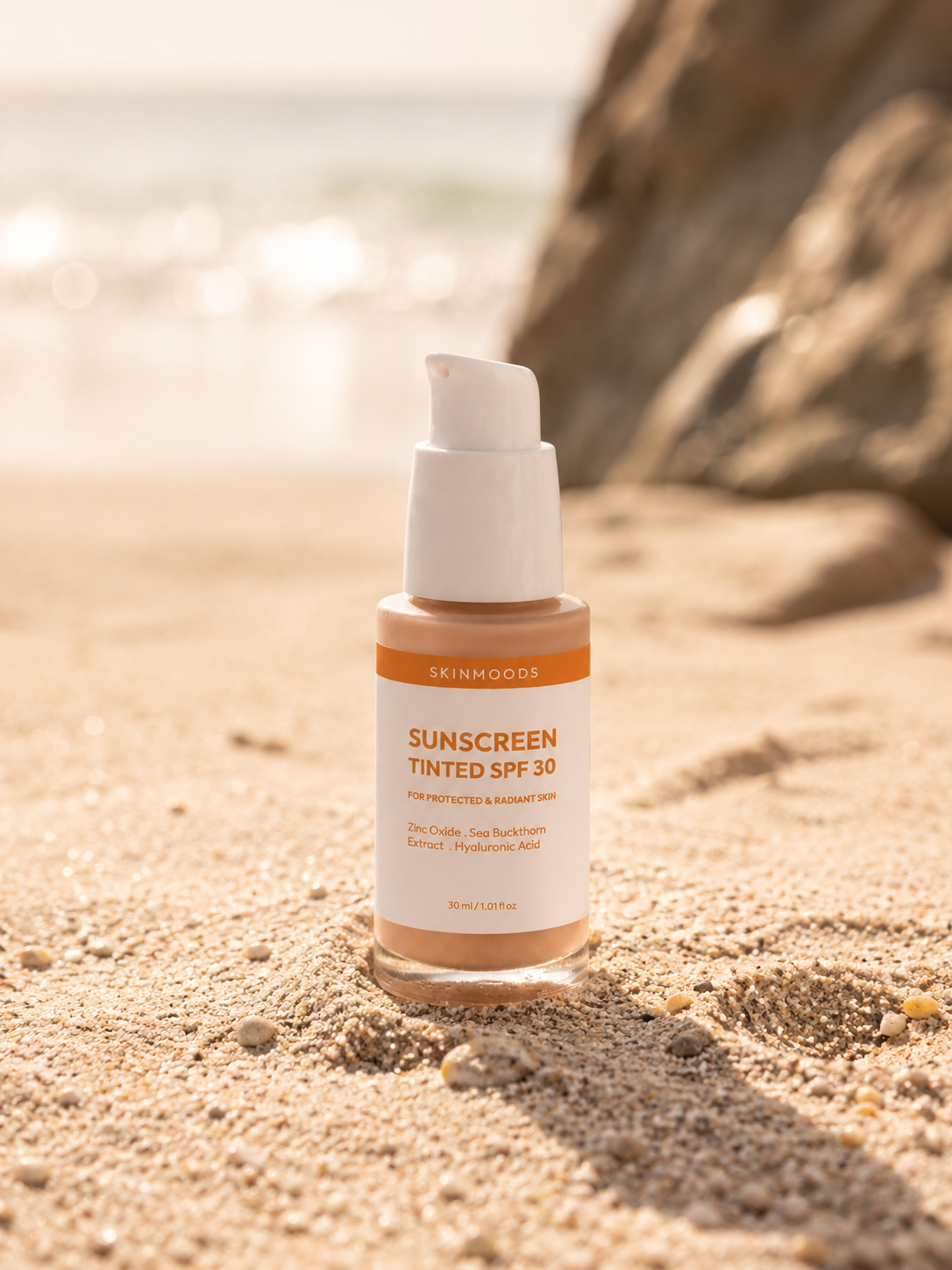 Skinmoods Sunscreen Tinted SPF30 on a sandy beach in the sun