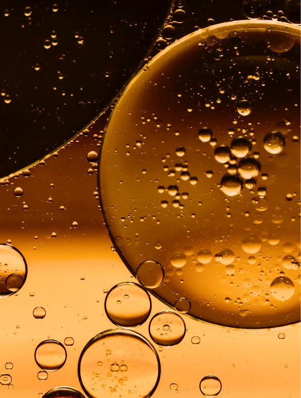 Close up Skinmoods glowing body oil texture