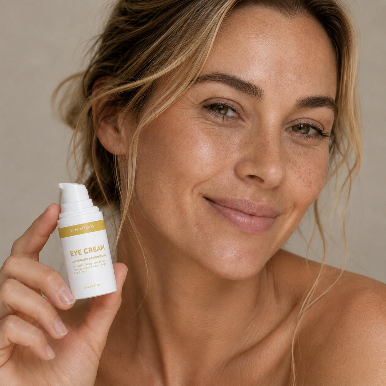 Model with Skinmoods Brightening Eye Cream in her hand